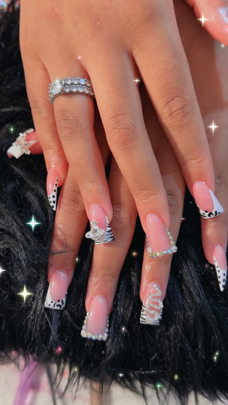Pink French with animal print tips and crystal swirls