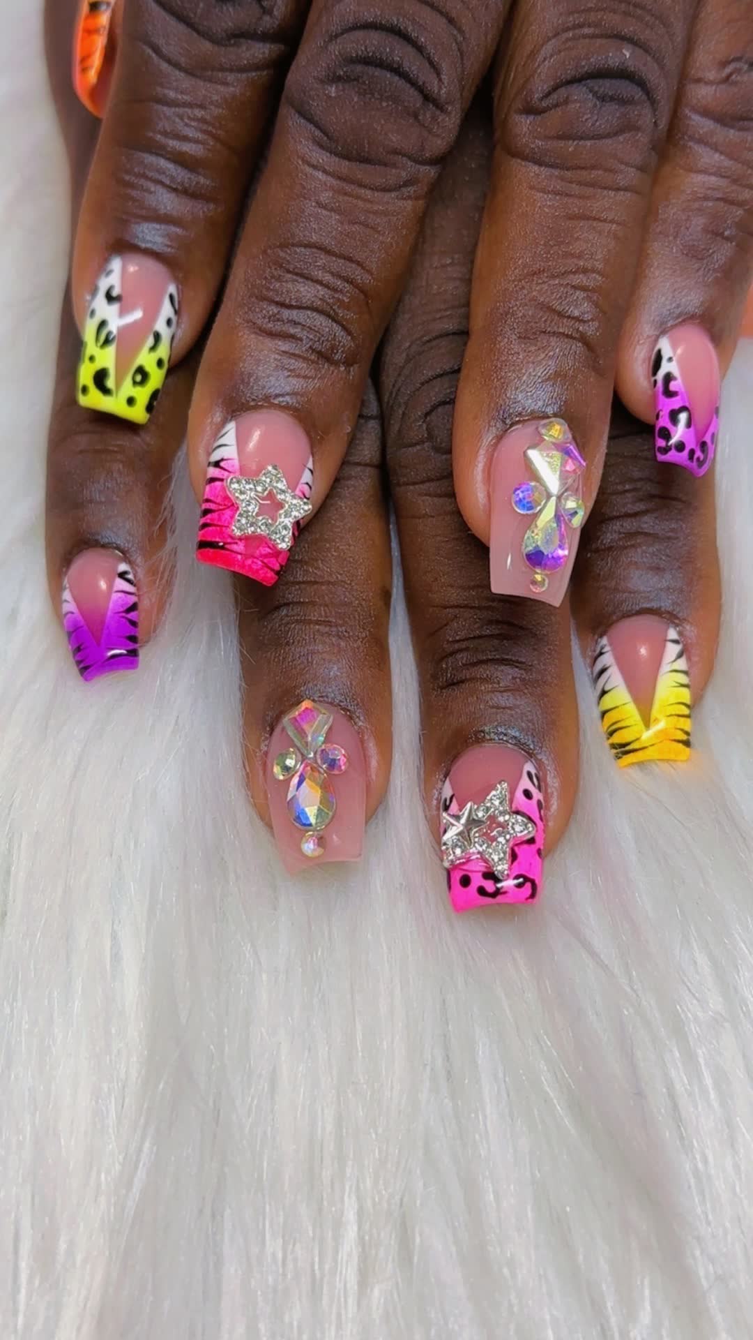 Neon animal print tips with star and gem accents