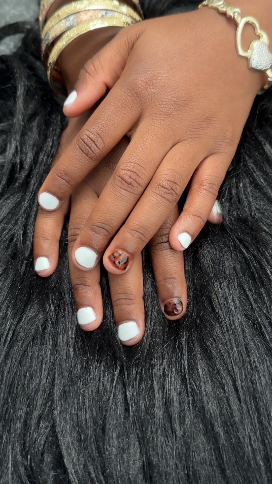 White polish with leopard accent, natural nails